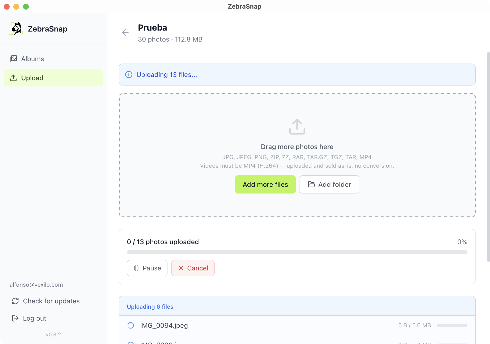 The desktop app uploading with per-file progress bars